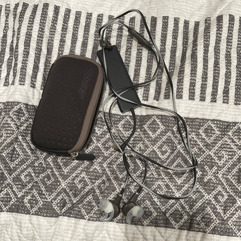 Bose headphones with noise cancellation.